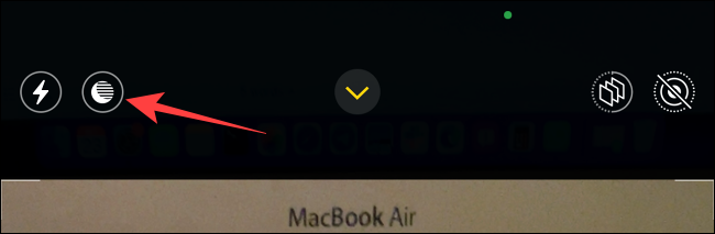 Tap-night-mode-button-in-camera-app-on-iphone